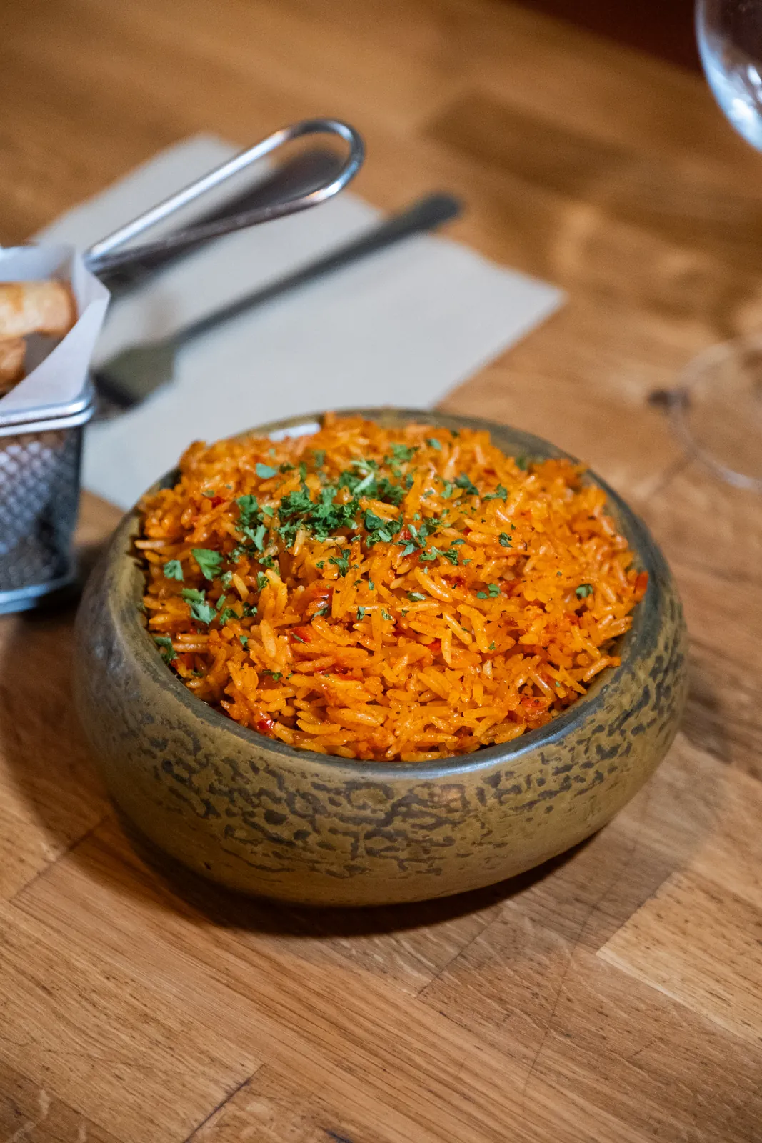 Smoky rice served in a textured bowl