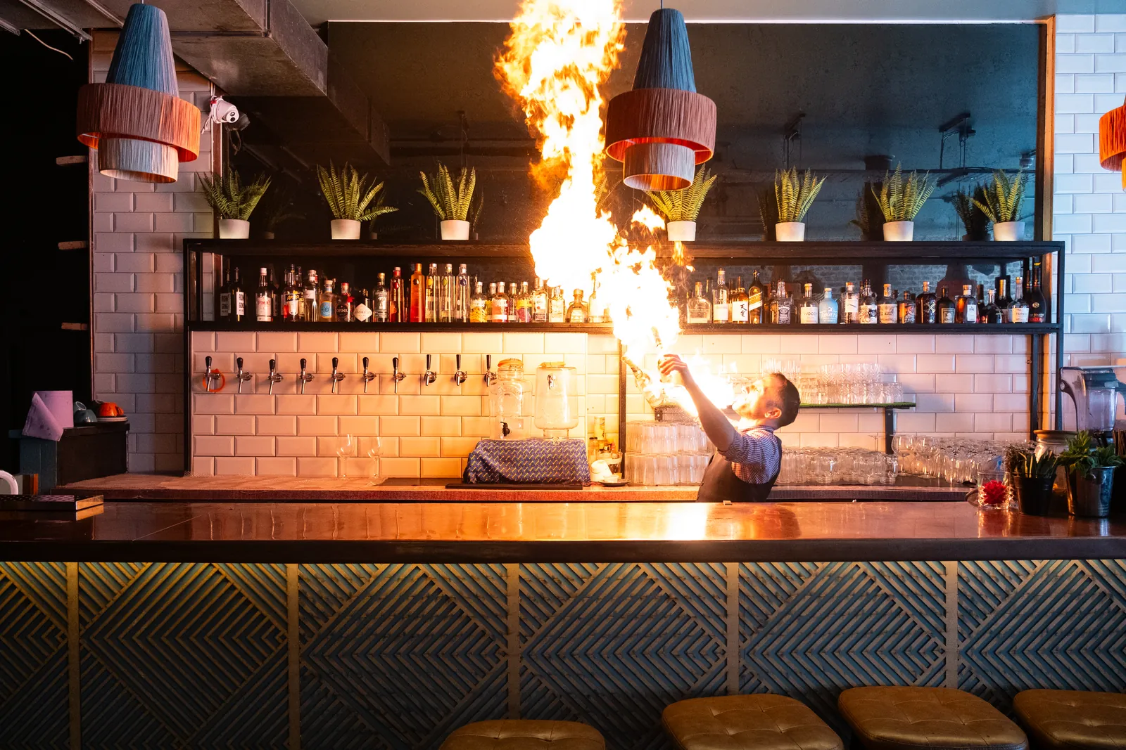 A fire performance lighting up the Monika bar