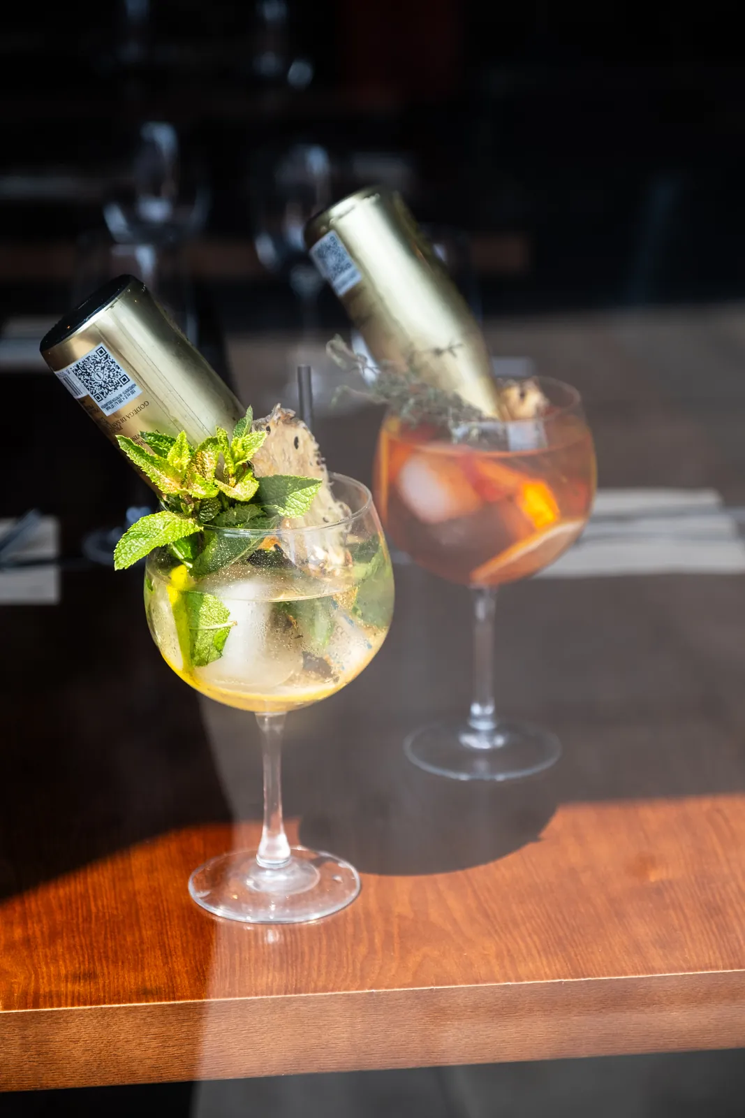 Two sparkling cocktails at the bar