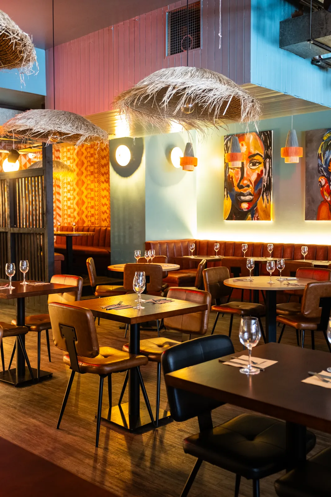The Monika dining room with warm lighting and set tables