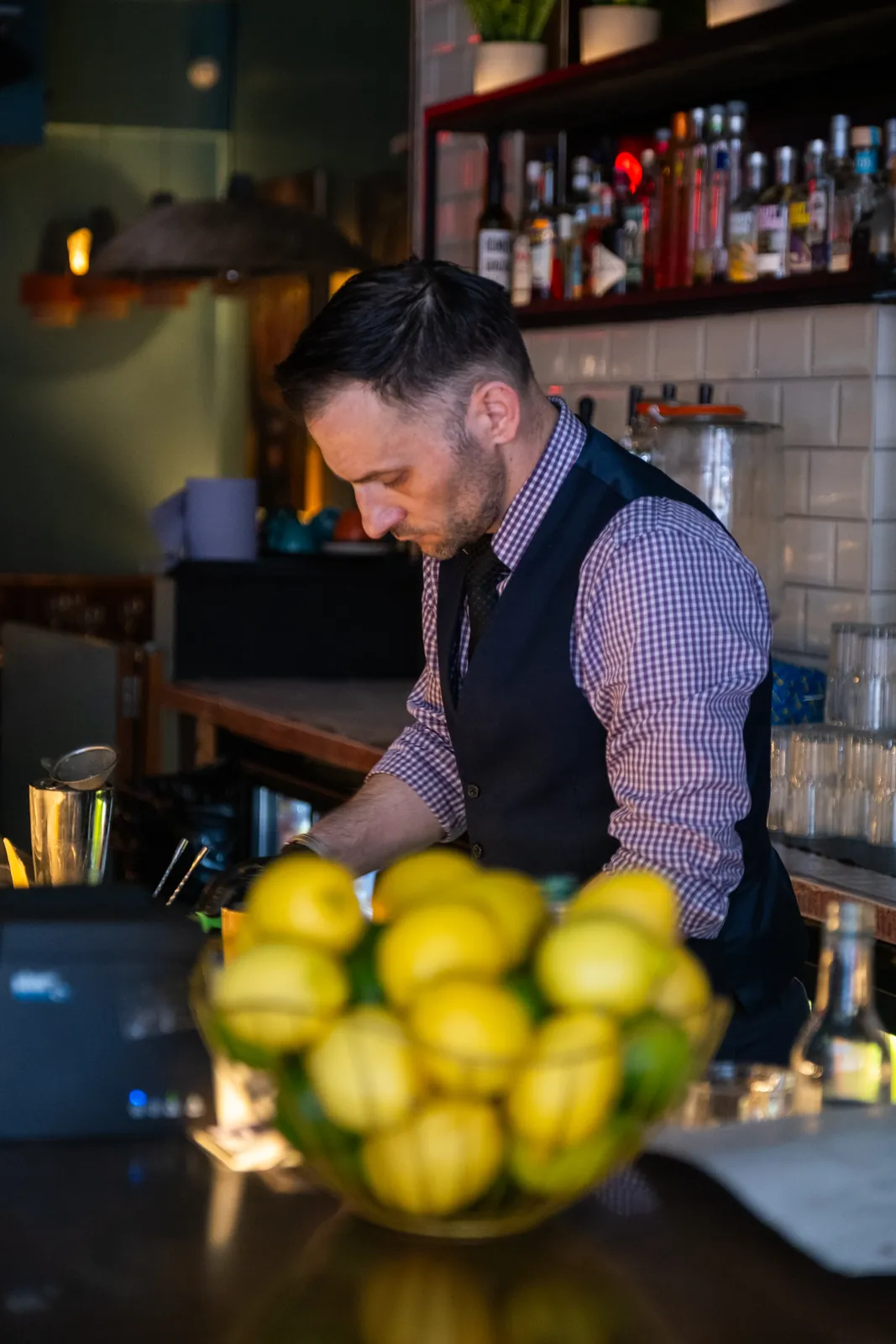 The bartender preparing drinks at Monika
