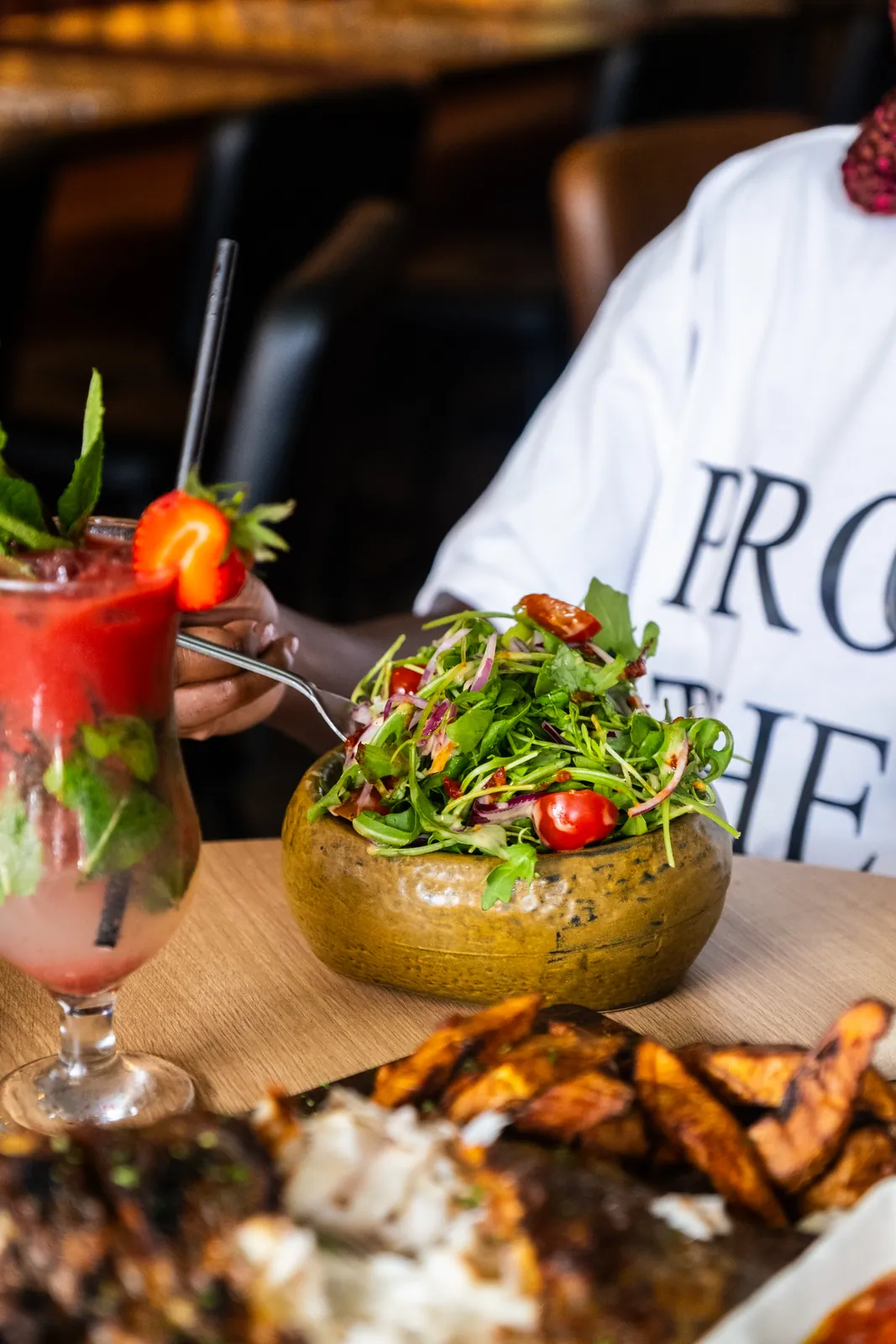 Fresh salad alongside grilled fish