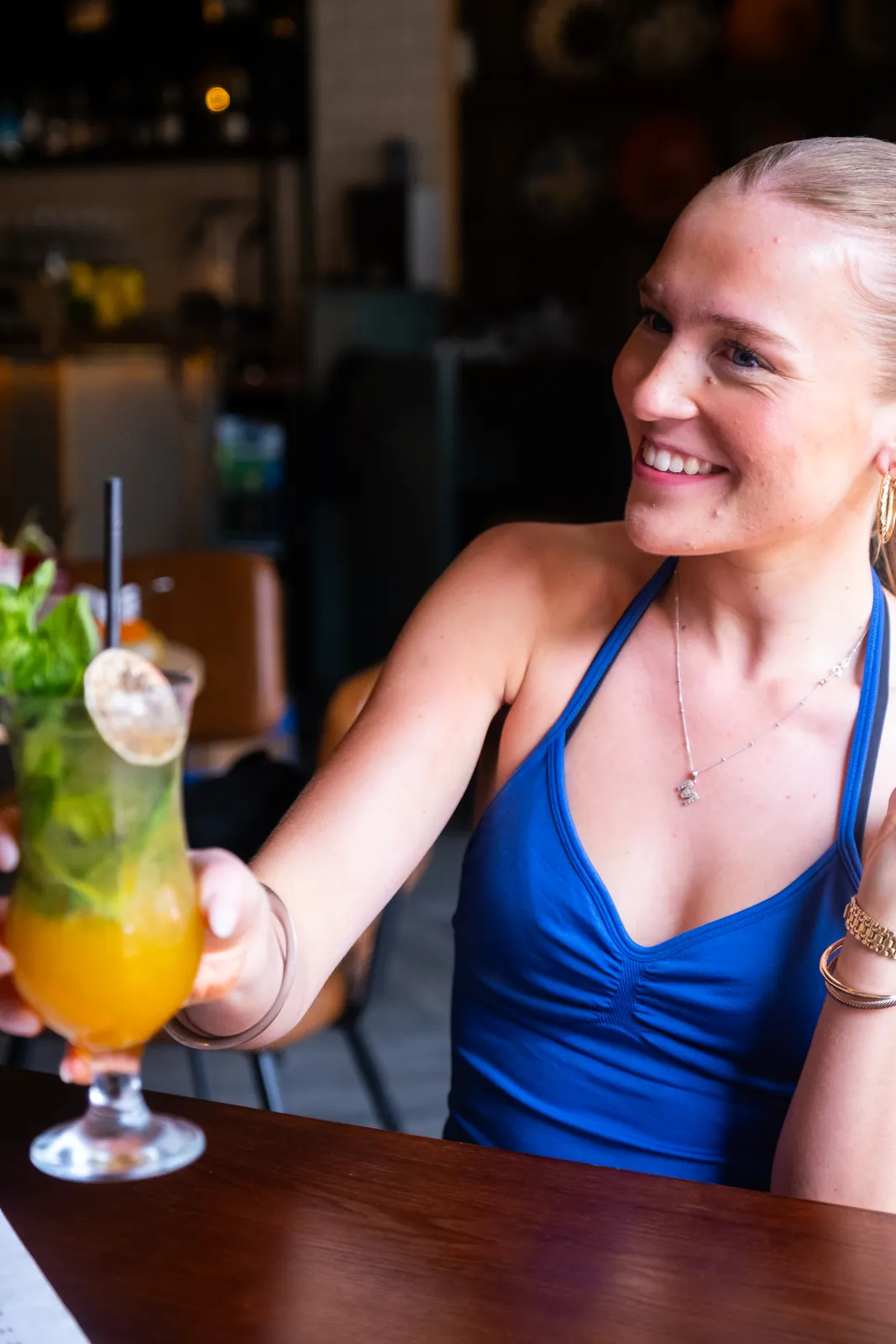 A guest enjoying a cocktail at the bar