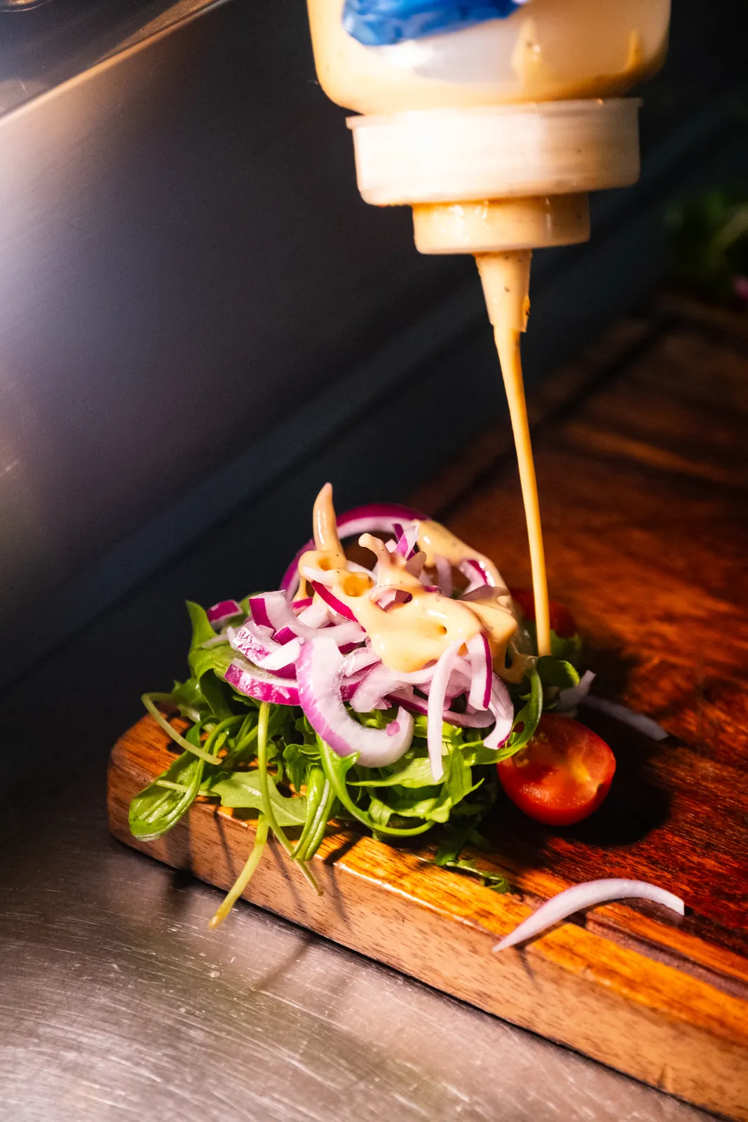 Finishing a plate with sauce