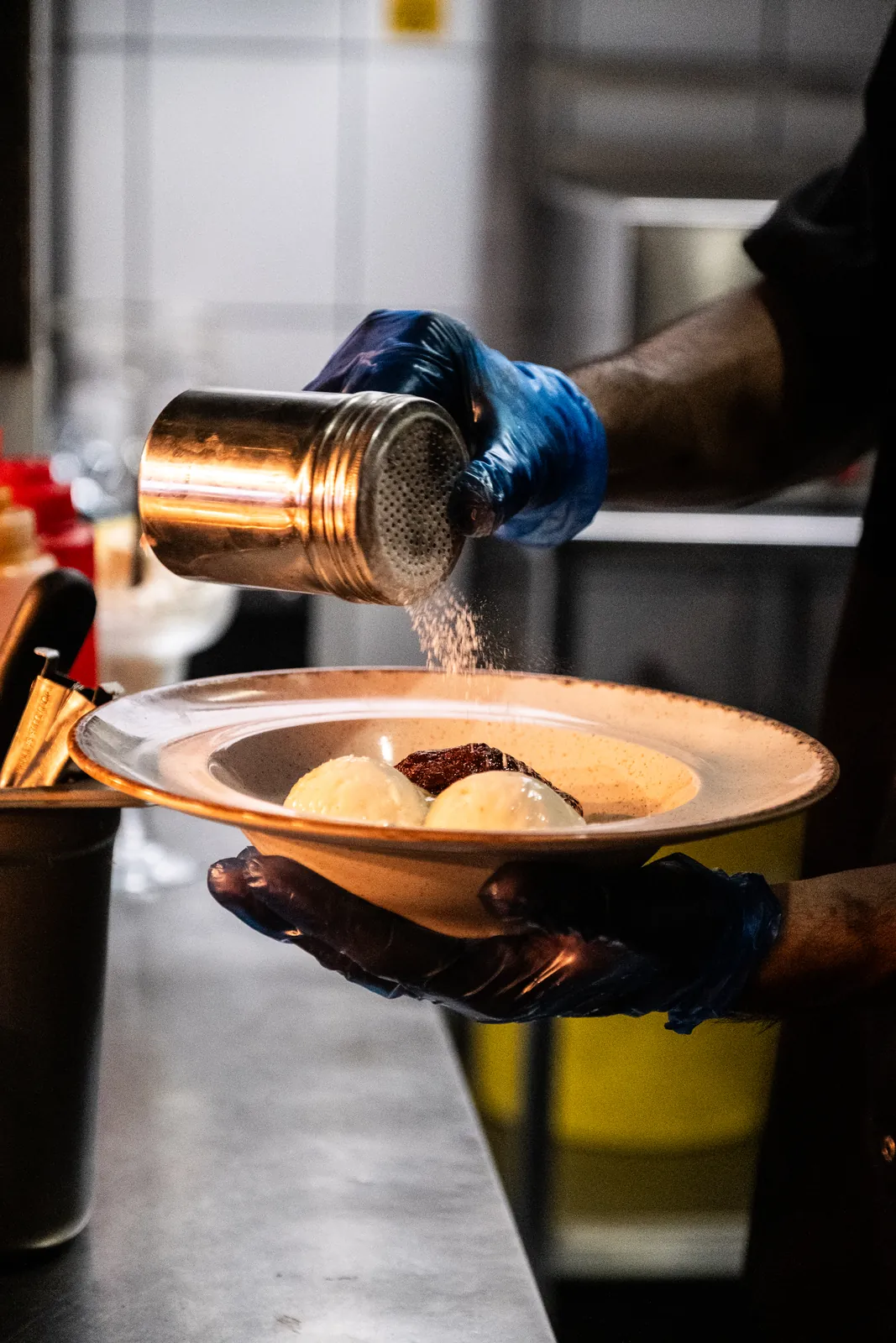Dessert being finished in the kitchen