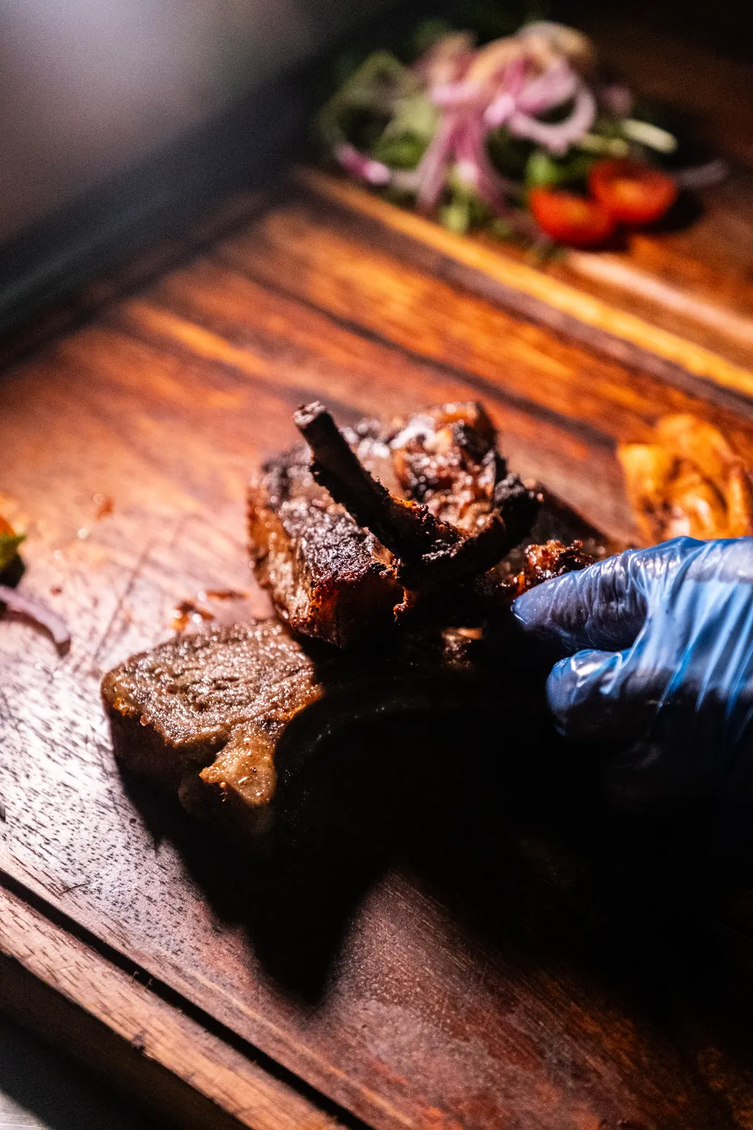 Preparing grilled lamb for service