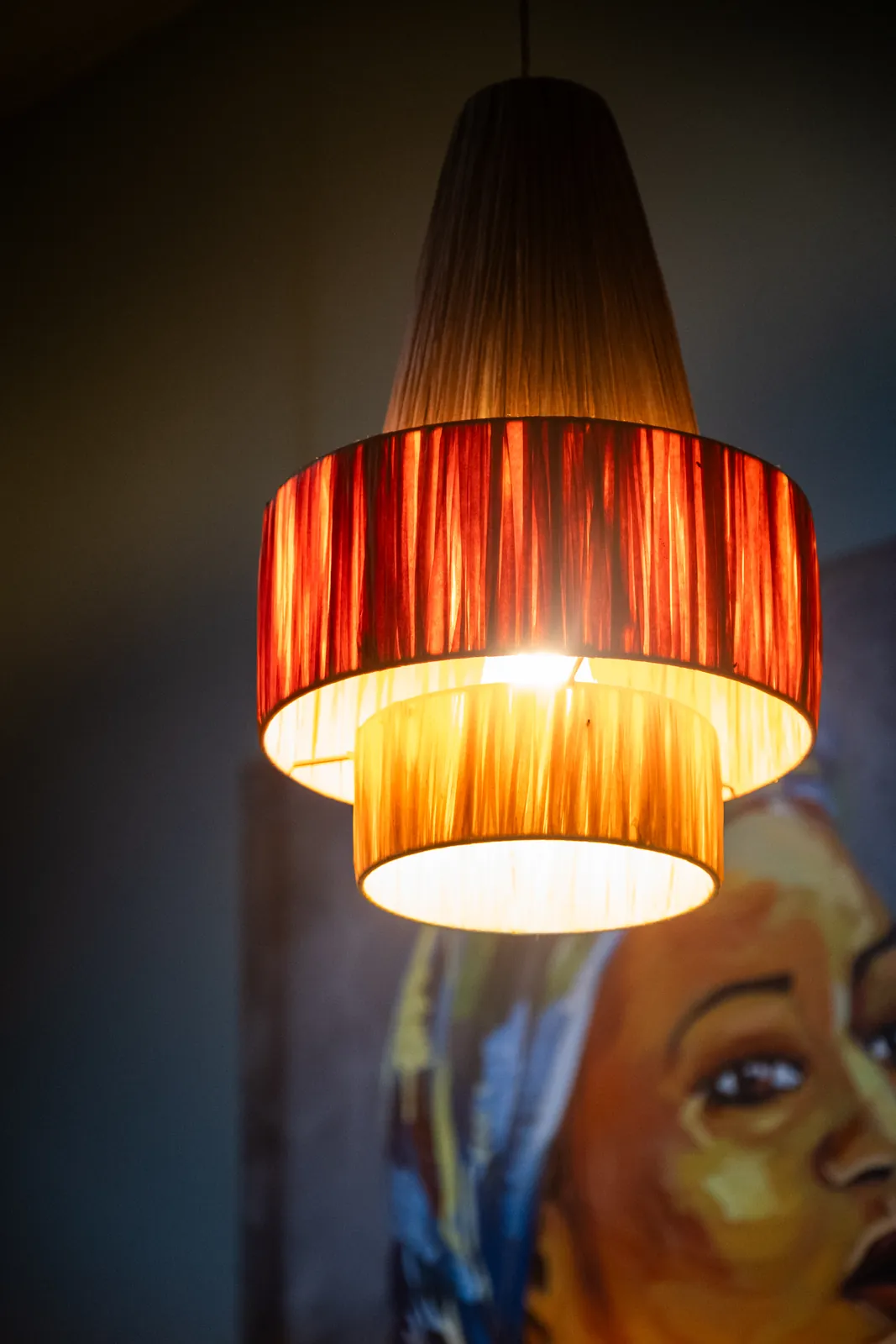 A warm pendant light in the restaurant