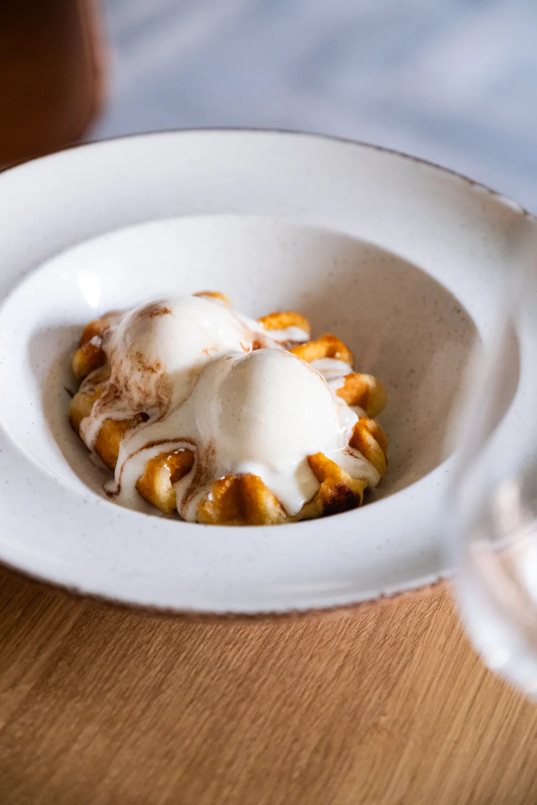 A plated dessert with ice cream