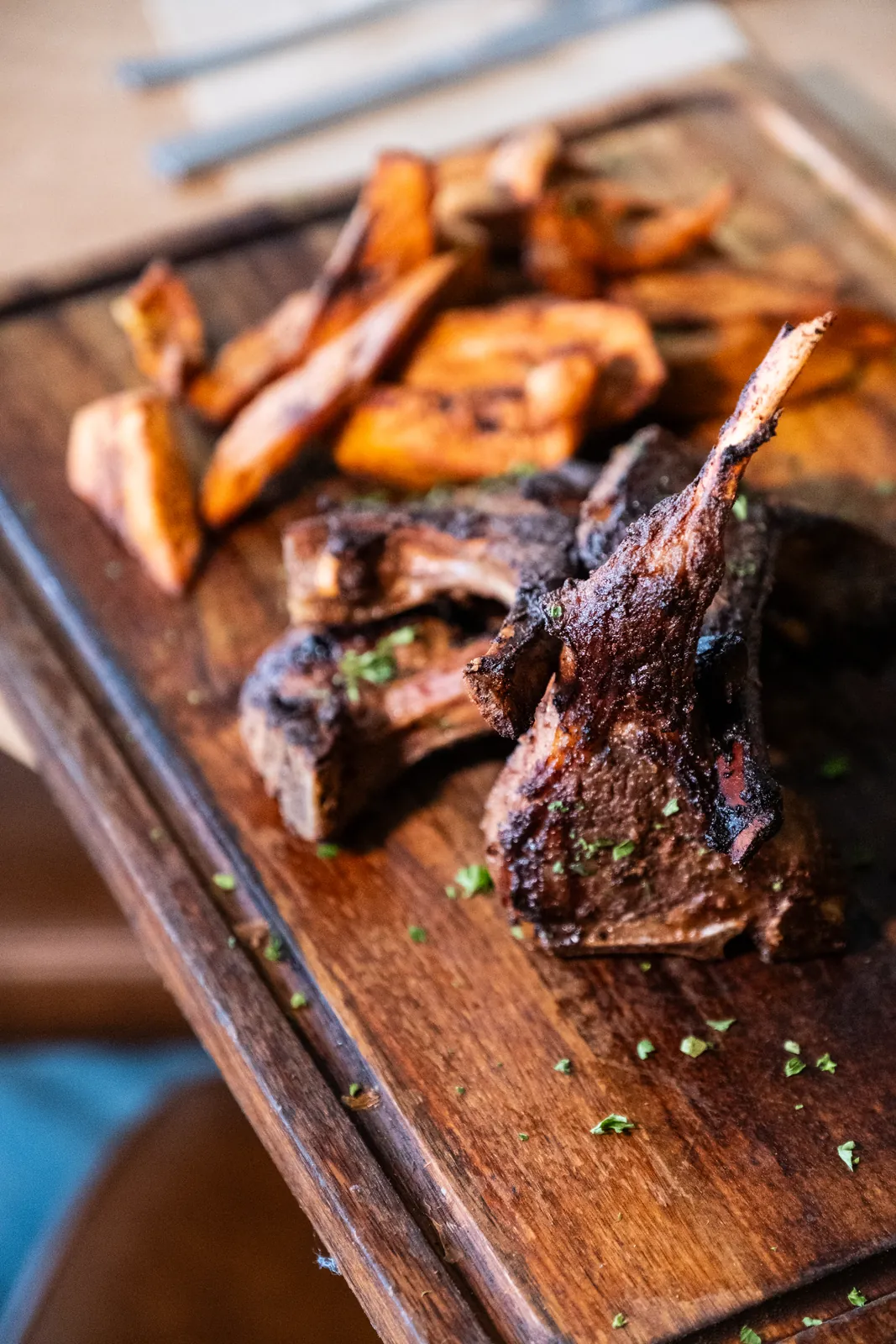 Chargrilled meat and plantain on a sharing board