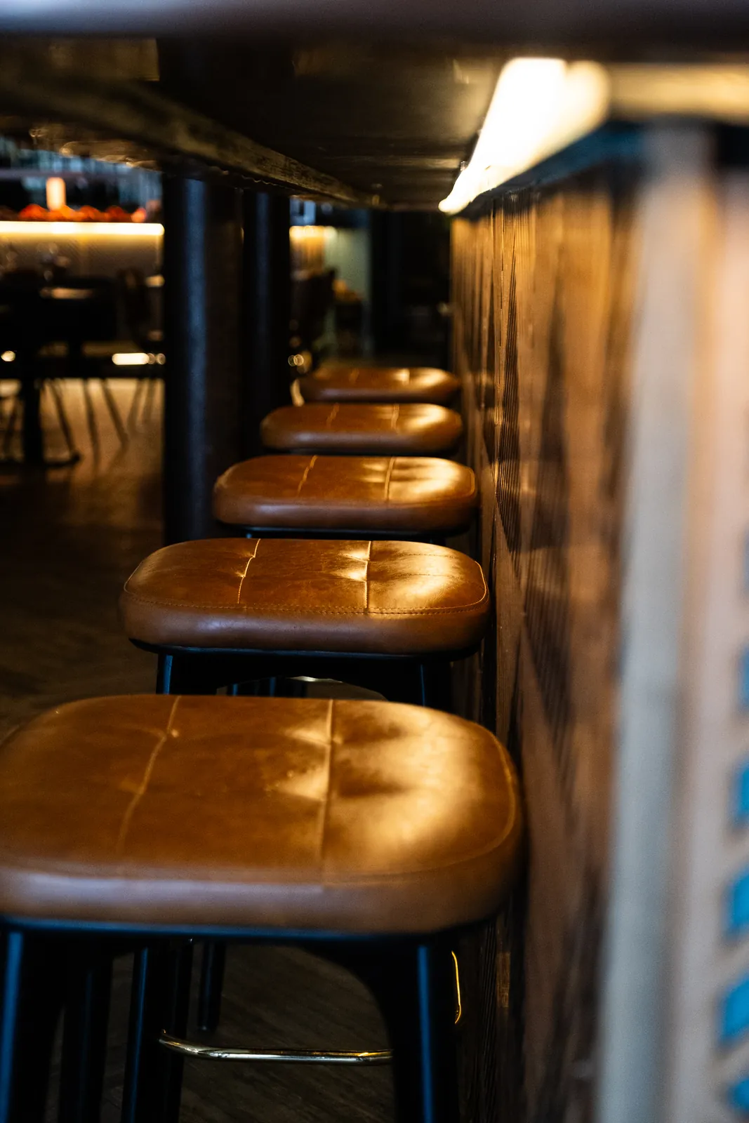 A row of seats at the Monika bar