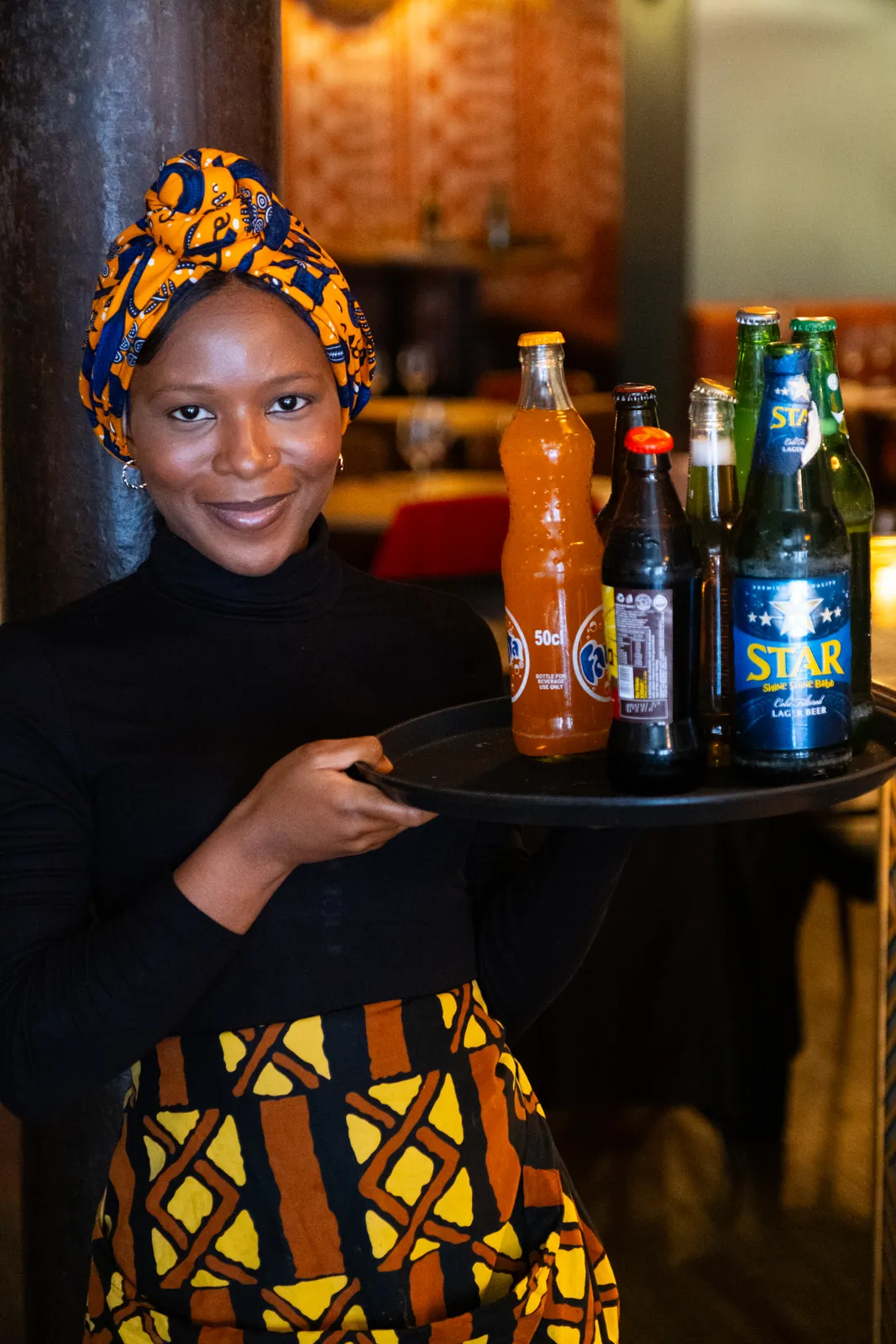 A member of the Monika team presenting drinks