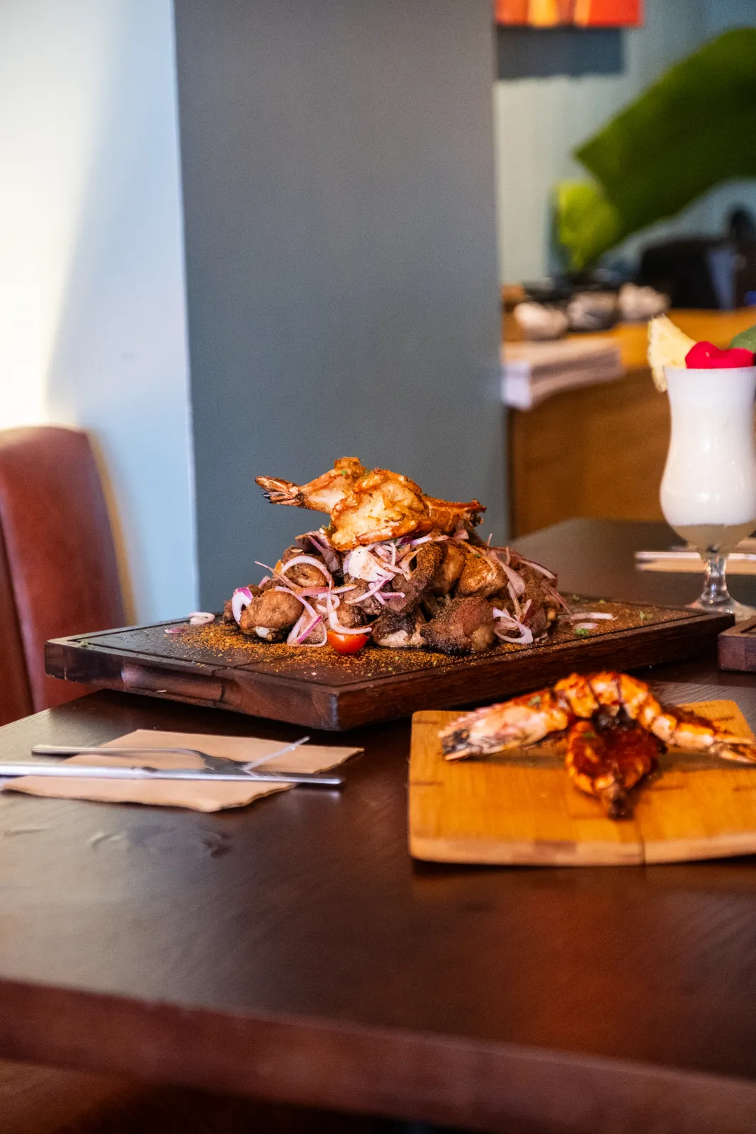 Grilled sharing dishes at a set table
